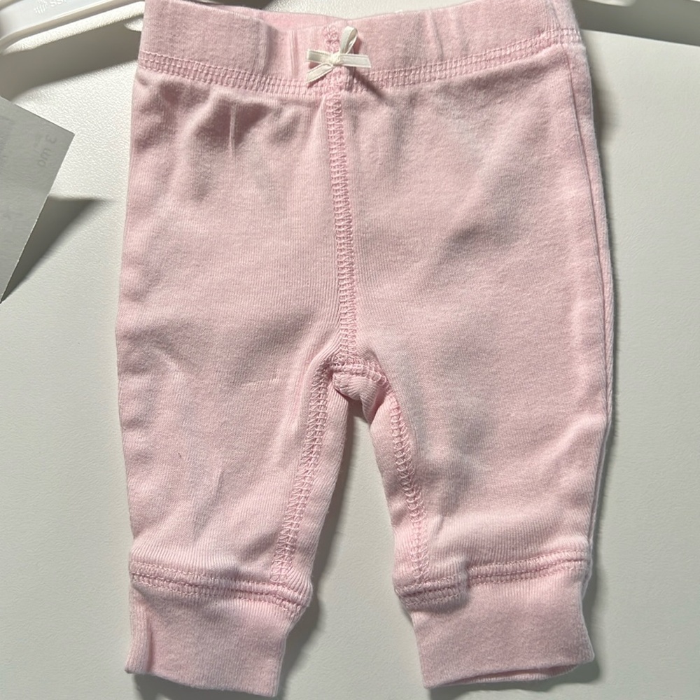 3 for $9 
NWOT Carter’s cotton pants, pink. Never worn, size newborn